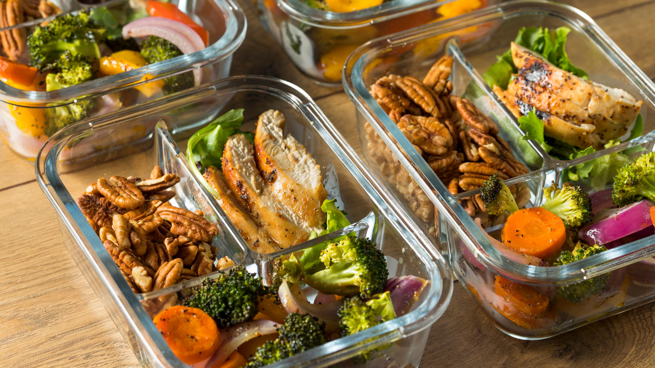 Meal prep containers with tasty healthy food, like chicken and veggies